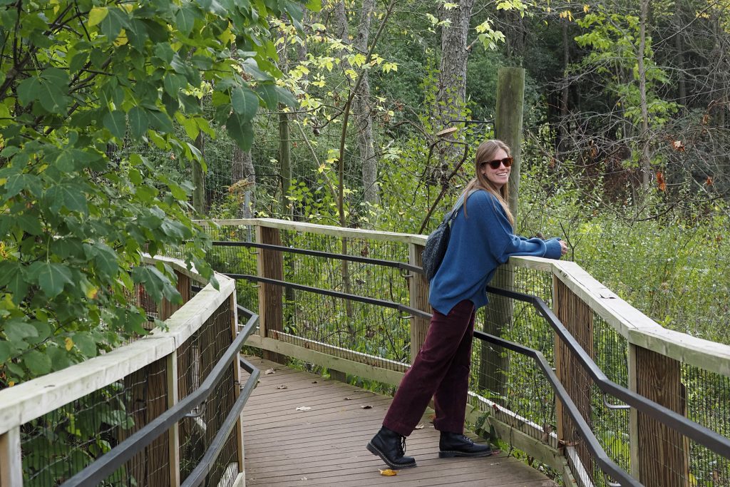 woman on boardwalk looking over shoulder
